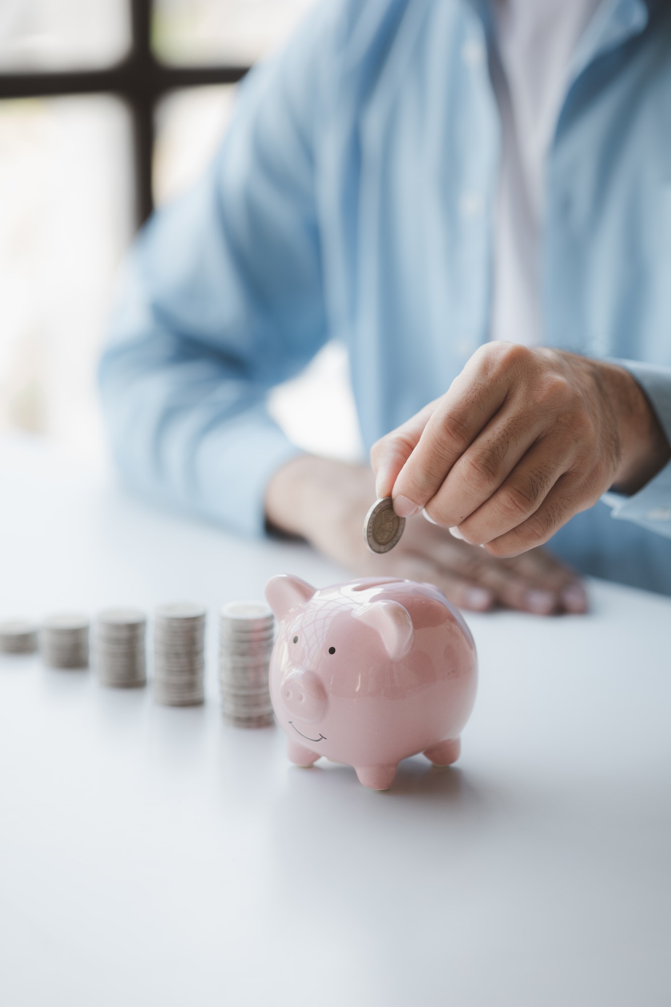 person-with-pile-of-coins-and-piggy-bank-money-saving-concept-for-future-use-and-financial-stabilit.jpg person-with-pile-of-coins-and-piggy-bank-money-saving-concept-for-future-use-and-financial-stabilit.jpg